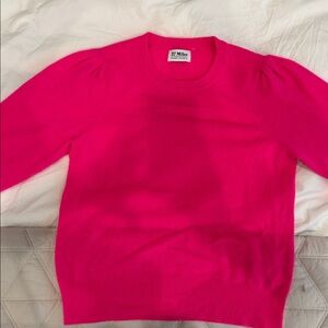 Bright pink cashmere sweater with wrist and shoulder detail